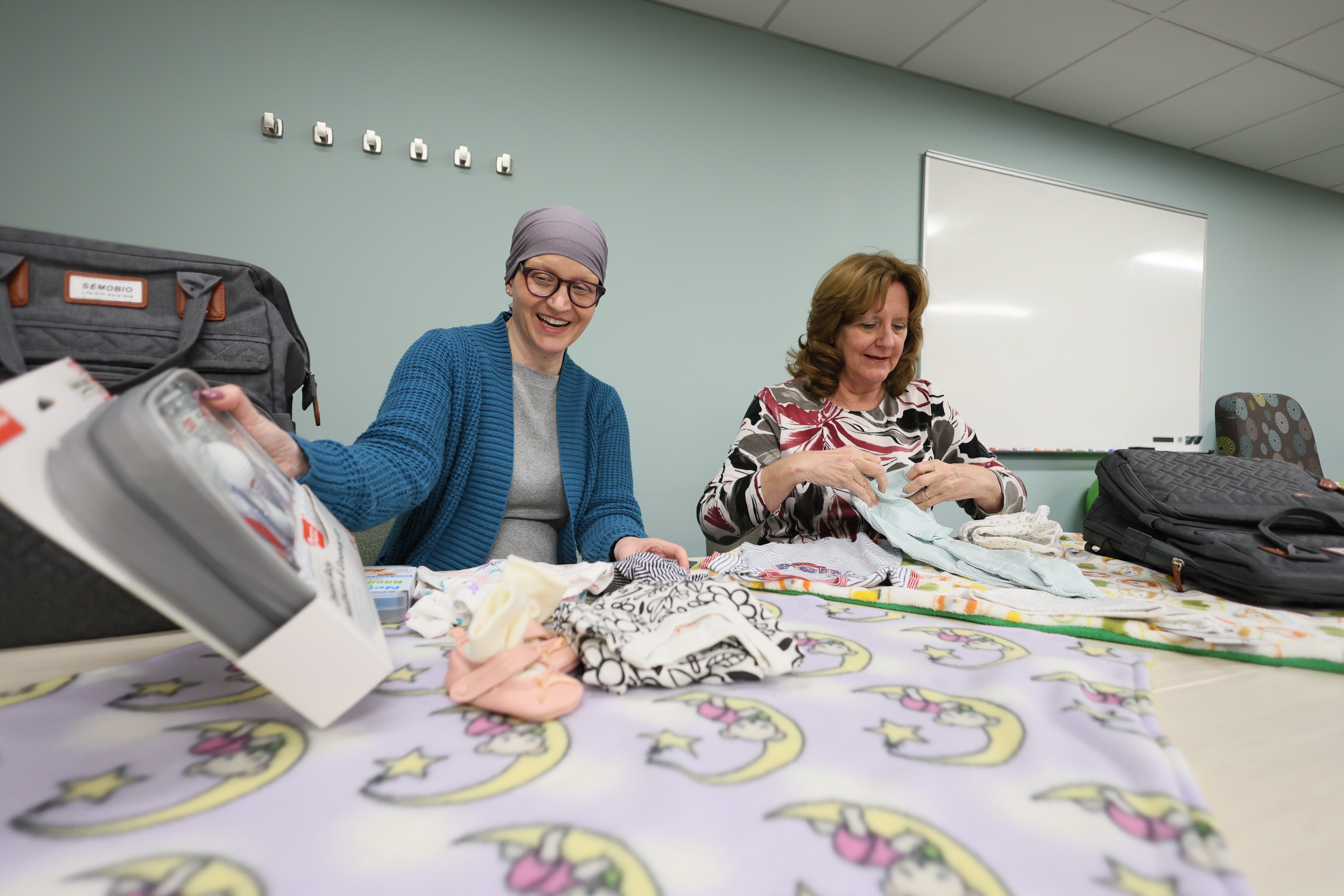 Poland (left) and Renn-Bugai (right) personally make soft, handmade blankets